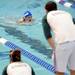 Coaches stand by as a swimmer participates in a race during the Washtenaw Interclub Swim Conference championships at Skyline High School on Thursday, July 25, 2013. Melanie Maxwell | AnnArbor.com